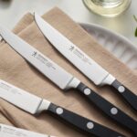 HENCKELS Juego de 4 cuchillos clásicos para carne, diseño alemán informado por más de 100 años de maestría, negro/acero