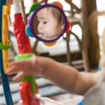 Baby Einstein Neighborhood Symphony Activity Centro de Actividades Saltador para Bebés, Entretenedor Infantil con Luces