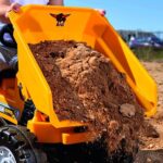 Big: Jim Dumper Ride-On - Vehículo de juguete de granja y construcción, camión con cama abatible, volante, bocina, asien