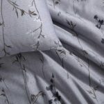 Juego de funda de edredón Queen satén algodón suave cierre de botón lazos en esquinas Calvin Klein Revman International