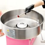 Máquina de Algodón de Azúcar Restaurantware RWT1009P Acero Inoxidable 21 Pulgadas Rosa 1080W