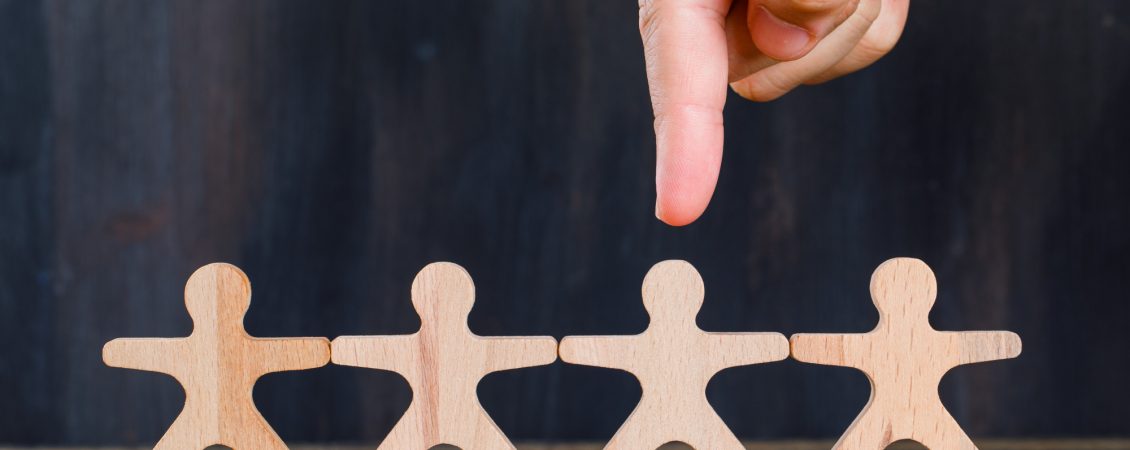 marketing-and-customer-analysis-concept-on-wooden-and-grunge-background-side-view-finger-targeting-wooden-man marketing-and-customer-analysis-concept-on-wooden-and-grunge-background-side-view-finger-targeting-wooden-man